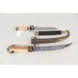 A vintage 'Jambya' with bone grip and white metal embellishment with a small Bowie,