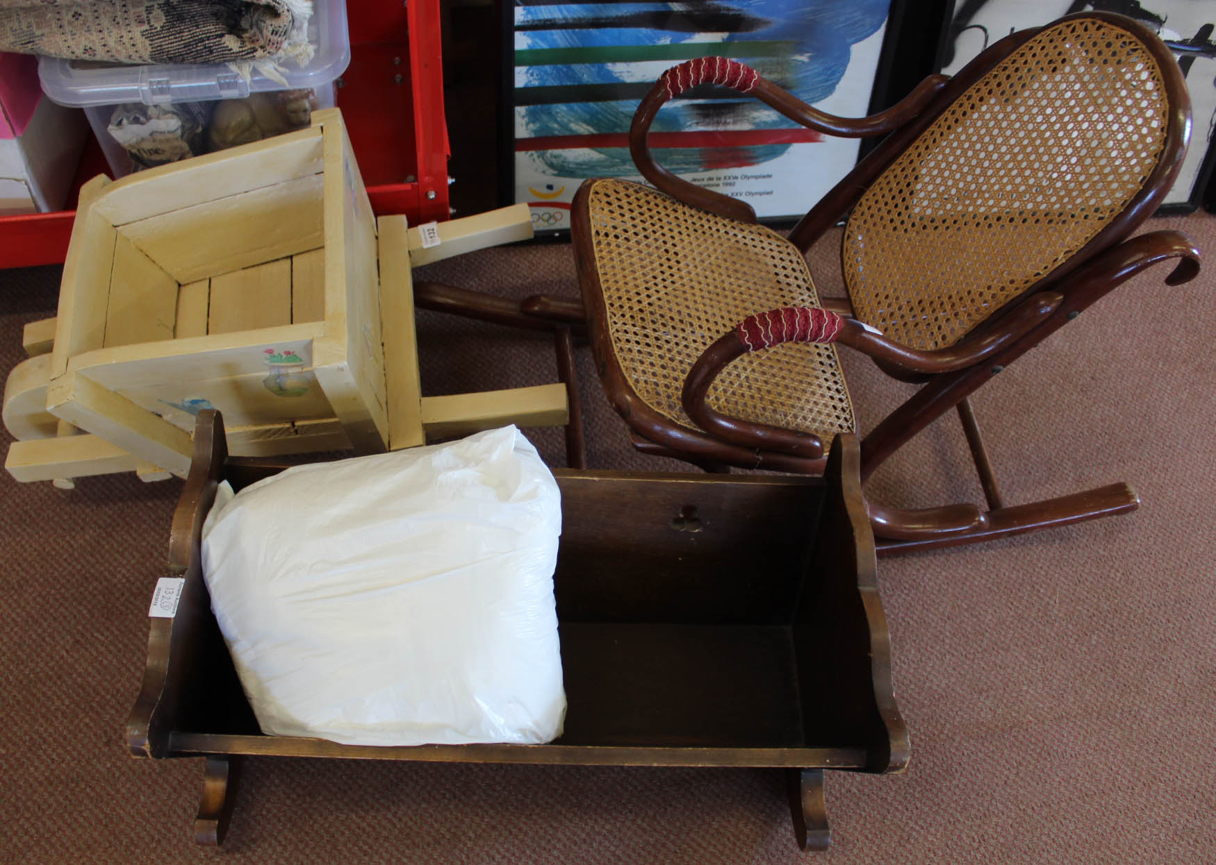 A childs wooden wheelbarrow,