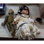 An early mohair monkey (detached arm) plus a porcelain Red Indian doll