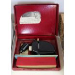 A boxed Eagle slide projector plus slides,