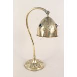 An Arts and Crafts floral embossed adjustable brass table lamp and shade with inset Ruskin style