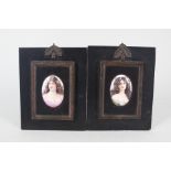 A pair of oval porcelain miniatures of ladies