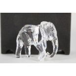 A boxed Swarovski elephant (tusks broken)