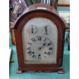 A mahogany cased striking mantel clock