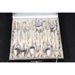 A set of six German silver spoons with twisted stem and hoof terminal design,