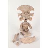 An Aztec style pottery figure (as found) plus a plaque