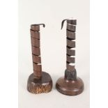 Two 18th Century spiral wood and iron candle holders