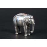 A silver pin cushion in the form of an elephant by A & J Zimmerman Ltd,