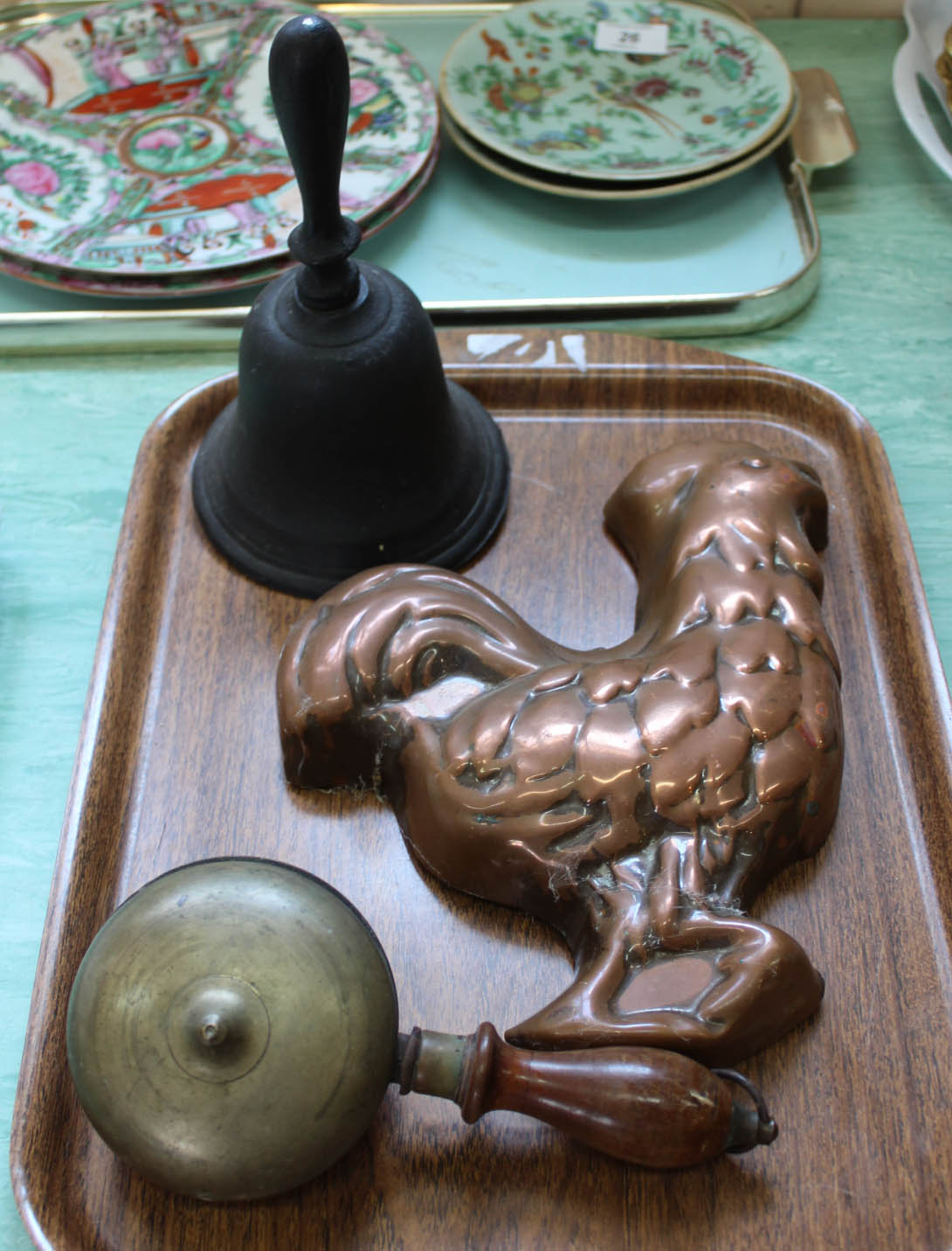 An unusual brass hand bell,