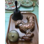 An unusual brass hand bell,