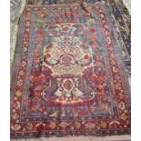 A Persian floral rug plus one other (as found)