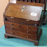 A miniature oak Georgian style bureau