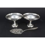 A pair of silver bon bon dishes (with weighted bases) together with a Dutch silver cake server with