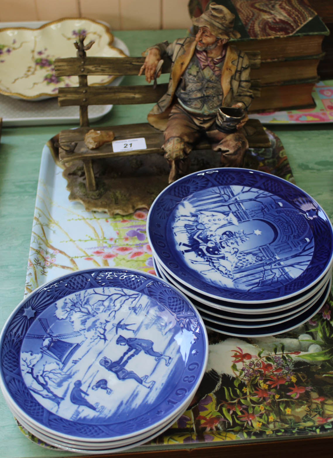 Ten Copenhagen Christmas plates plus a Capo Di Monte tramp on bench