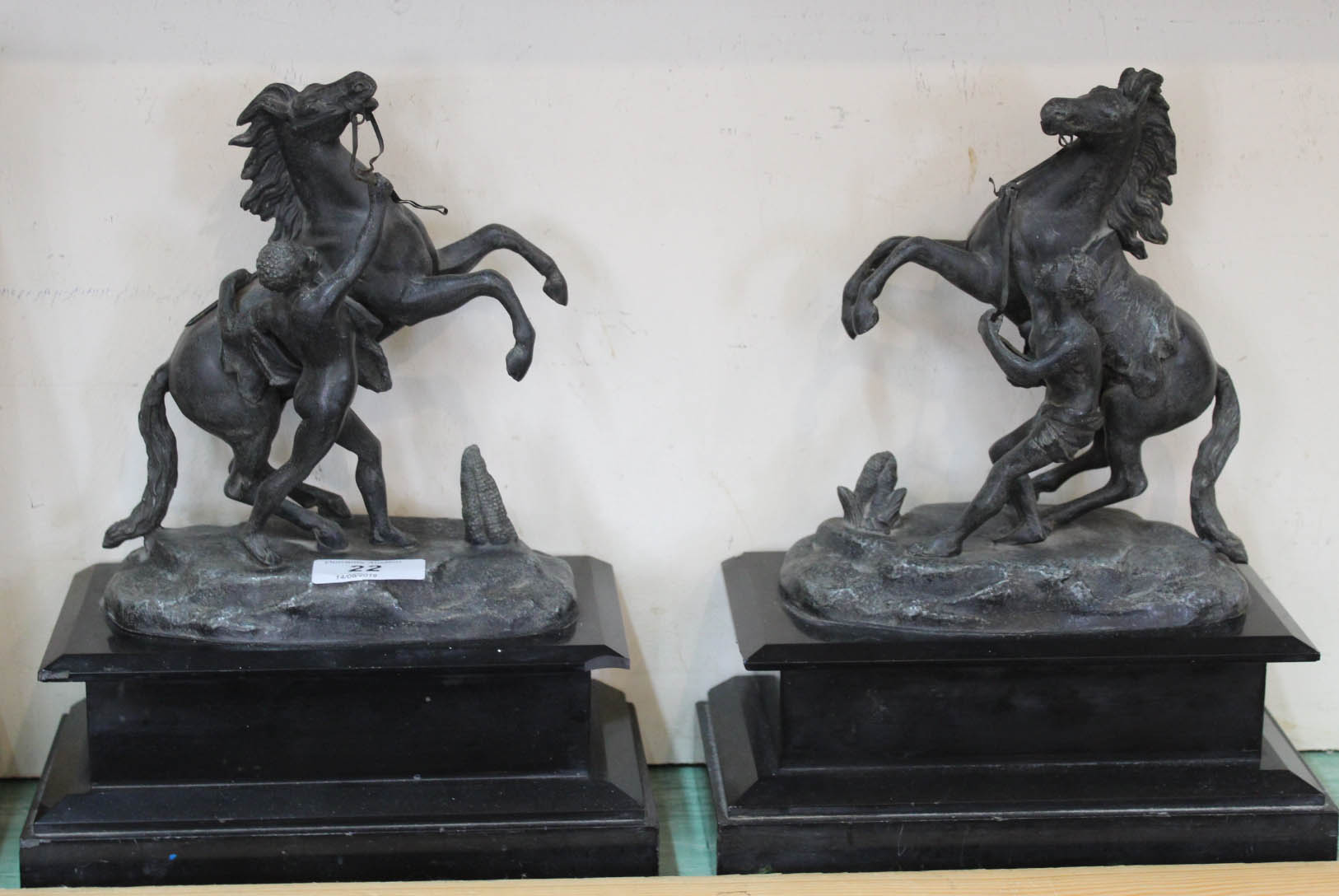 A pair of Victorian spelter Marli horses on black marble bases