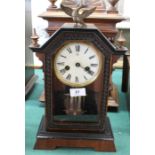 A Junghams mantel clock with brass eagle finial