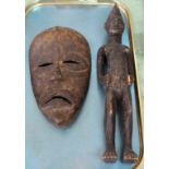 A Senufo tribal figure plus a West African mask,