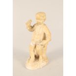 An 18th Century white glazed figure of a boy with grapes in Derby dry edge style,