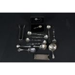 A mixed silver and white metal lot including three caddy spoons (two are as found),