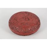 A cinnabar lacquer circular box with dragon and flaming pearl decoration, with 6 character mark,