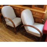 A pair of 1930's style bamboo conservatory chairs with pale blue upholstery