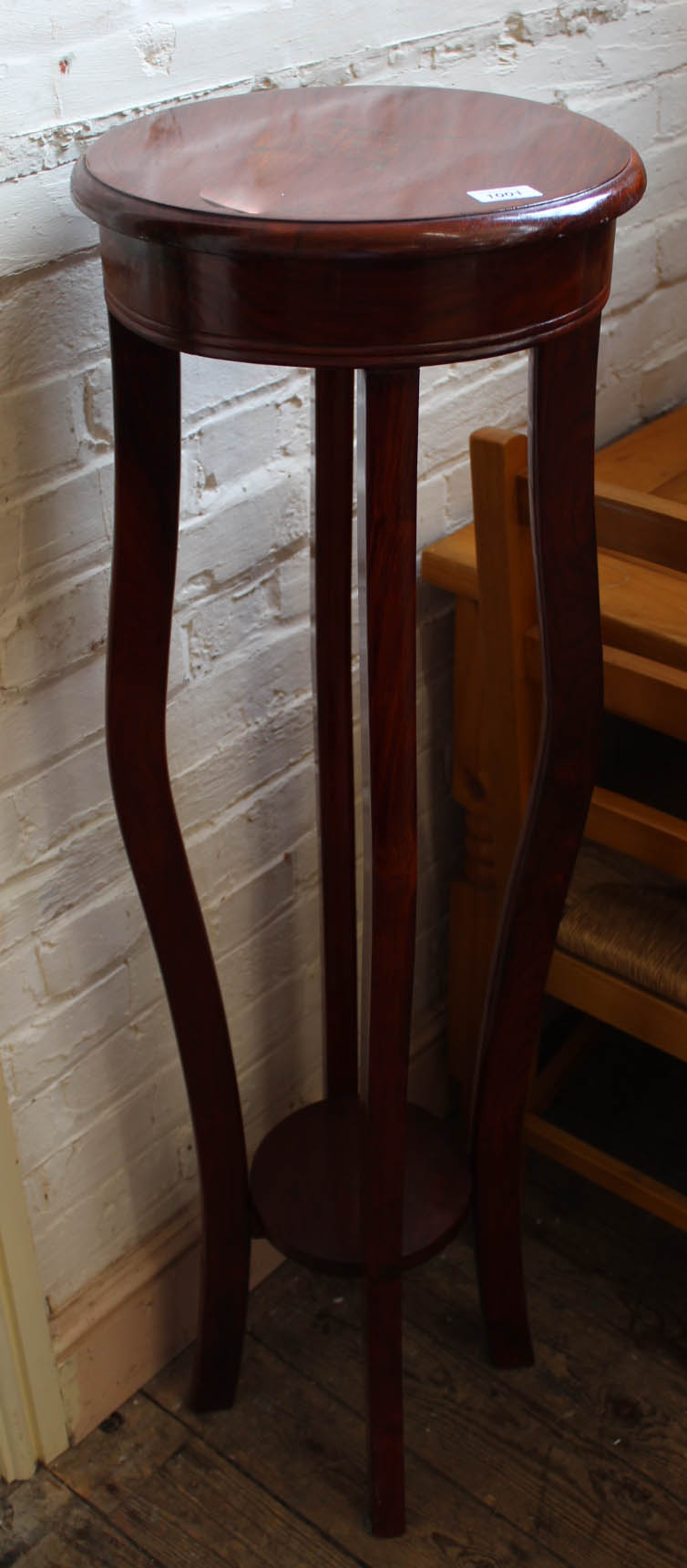 A rosewood plant stand torchere