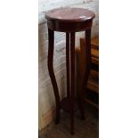 A rosewood plant stand torchere