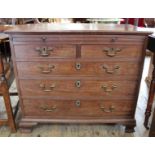 A George III mahogany chest of five drawers with slide,