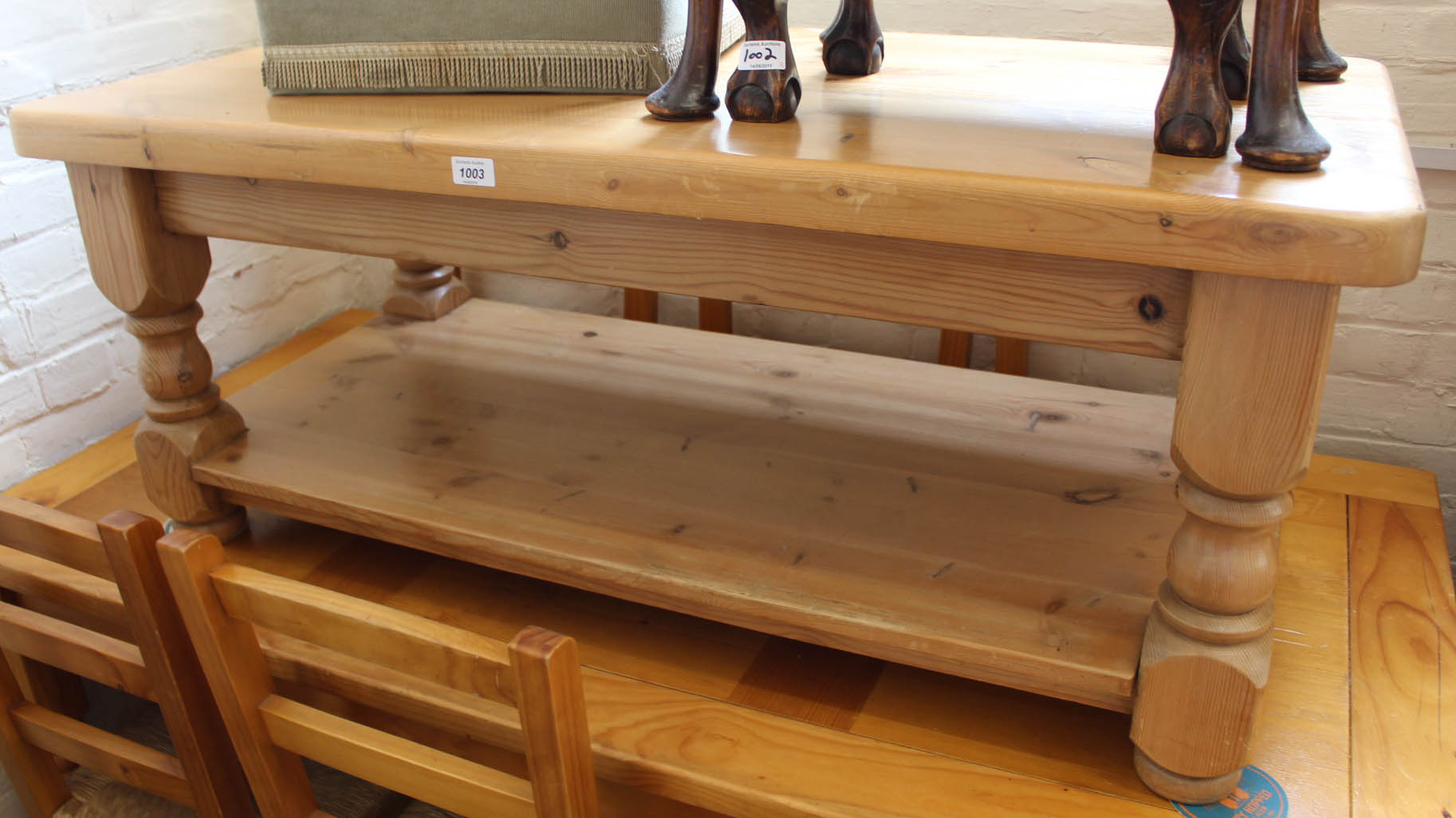 A modern pine coffee table with undertier