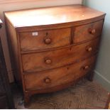 An early Victorian mahogany four drawer bow front chest with original knobs,