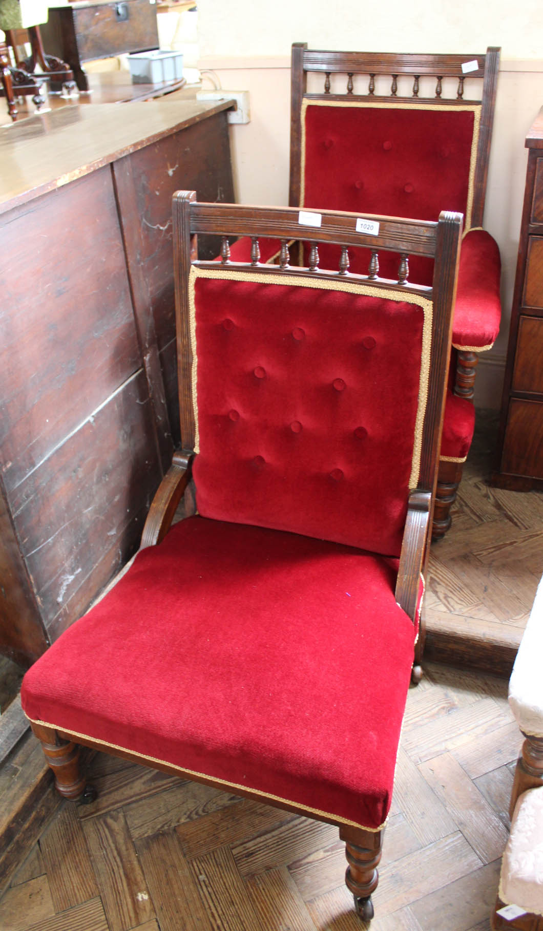 An Edwardian red velvet upholstered mahogany single chair and matching armchair