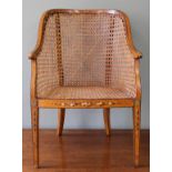 An early 19th Century satinwood rattan child's chair with original painted decoration