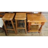 A modern pine table with single drawer and undertier and a pair of modern beech kitchen stools