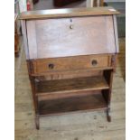 An Arts and Crafts oak narrow desk with one drawer,