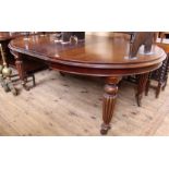 A Victorian mahogany extending dining table with one leaf and winding handle