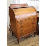 An Edwardian inlaid satinwood small roll top desk with four drawers