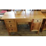 A modern hardwood dressing table with four drawers and single door