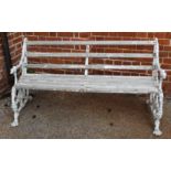 A white painted metal garden bench