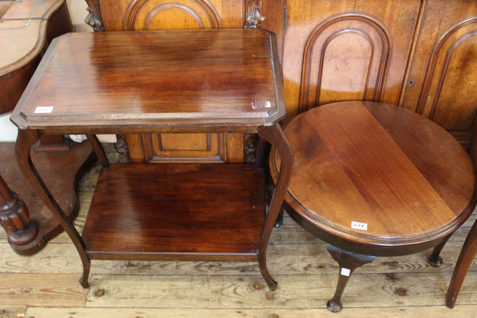 An Edwardian mahogany low round table and another Edwardian mahogany table