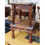 A modern mango wood coffee table and modern one drawer side table