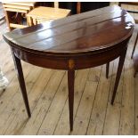 A 19th Century mahogany card table on square tapered legs