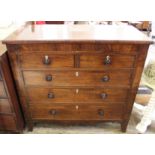 A Regency chest of two short and three long drawers with original knobs and ivory escutcheons