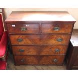 A late Georgian mahogany chest of two short and three long drawers with unusual hunting scene plate