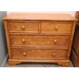 A modern hardwood four drawer chest