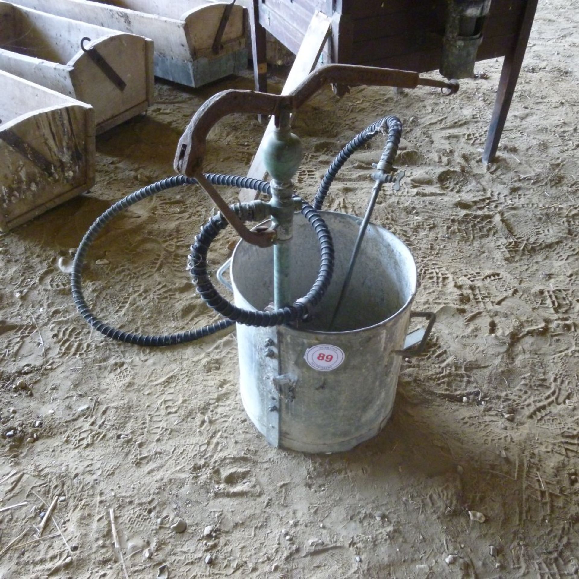 Galvanised bucket and hand pump