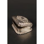 A silver snuff box with frilled edge and embossed lid,
