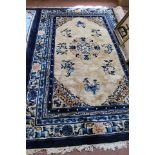 A Chinese blue ground floral rug,