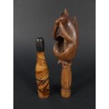 A pair of carved wooden squirrel nutcrackers plus a novelty champagne bottle pipe