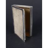 A silver and shagreen table snuff box in the form of a book with gilt interior,