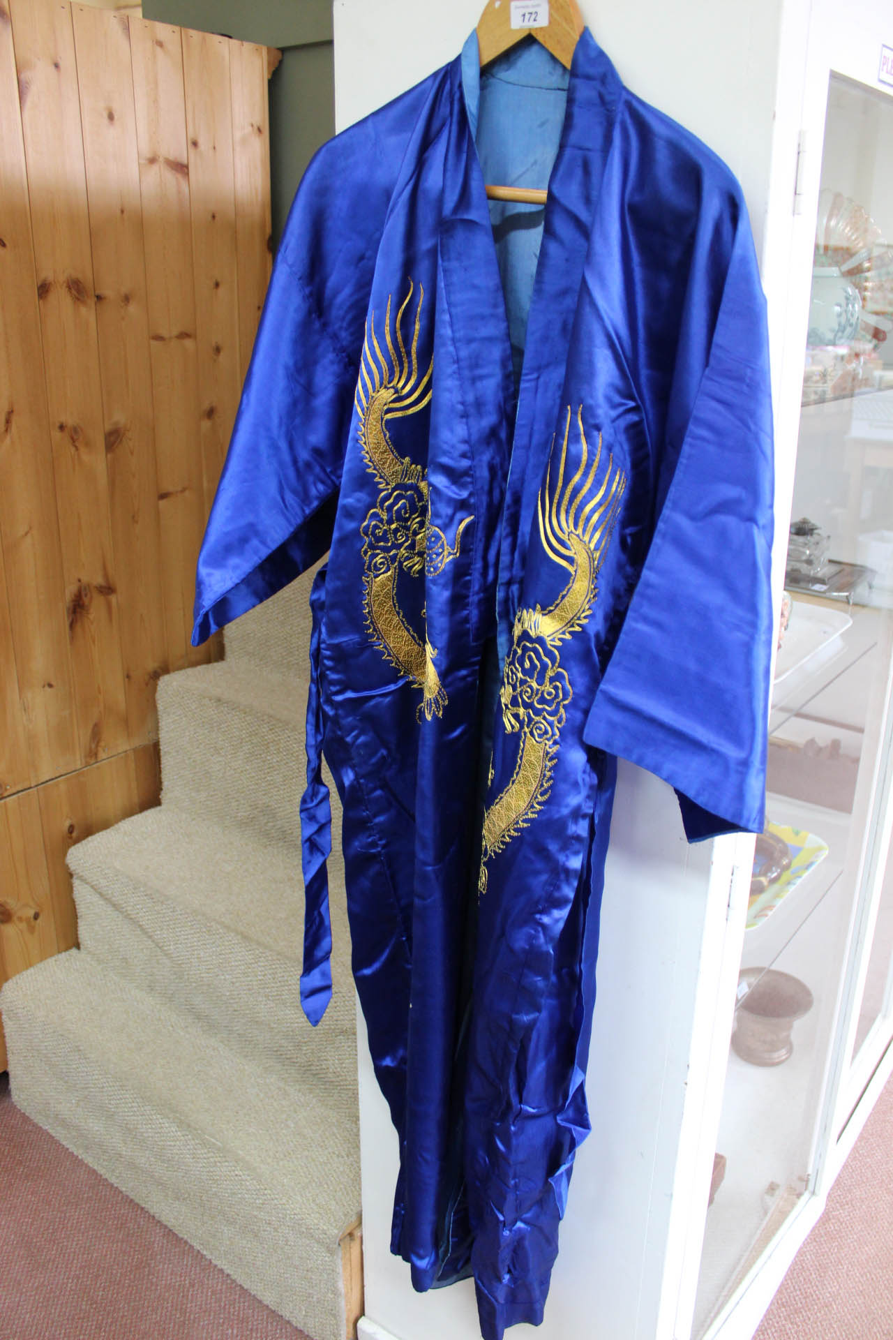 A blue silk kimono with gold thread dragon decoration